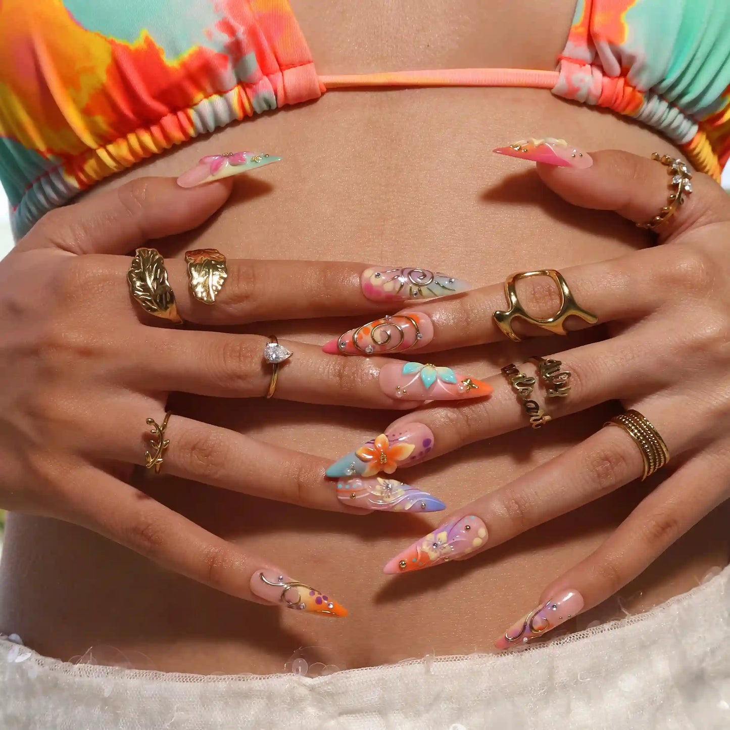 Handmade summer stiletto press-on nails with abundant multicolour florals, 3D blooms, gold spiral charms and crystal embellishments by Lily Nails Art