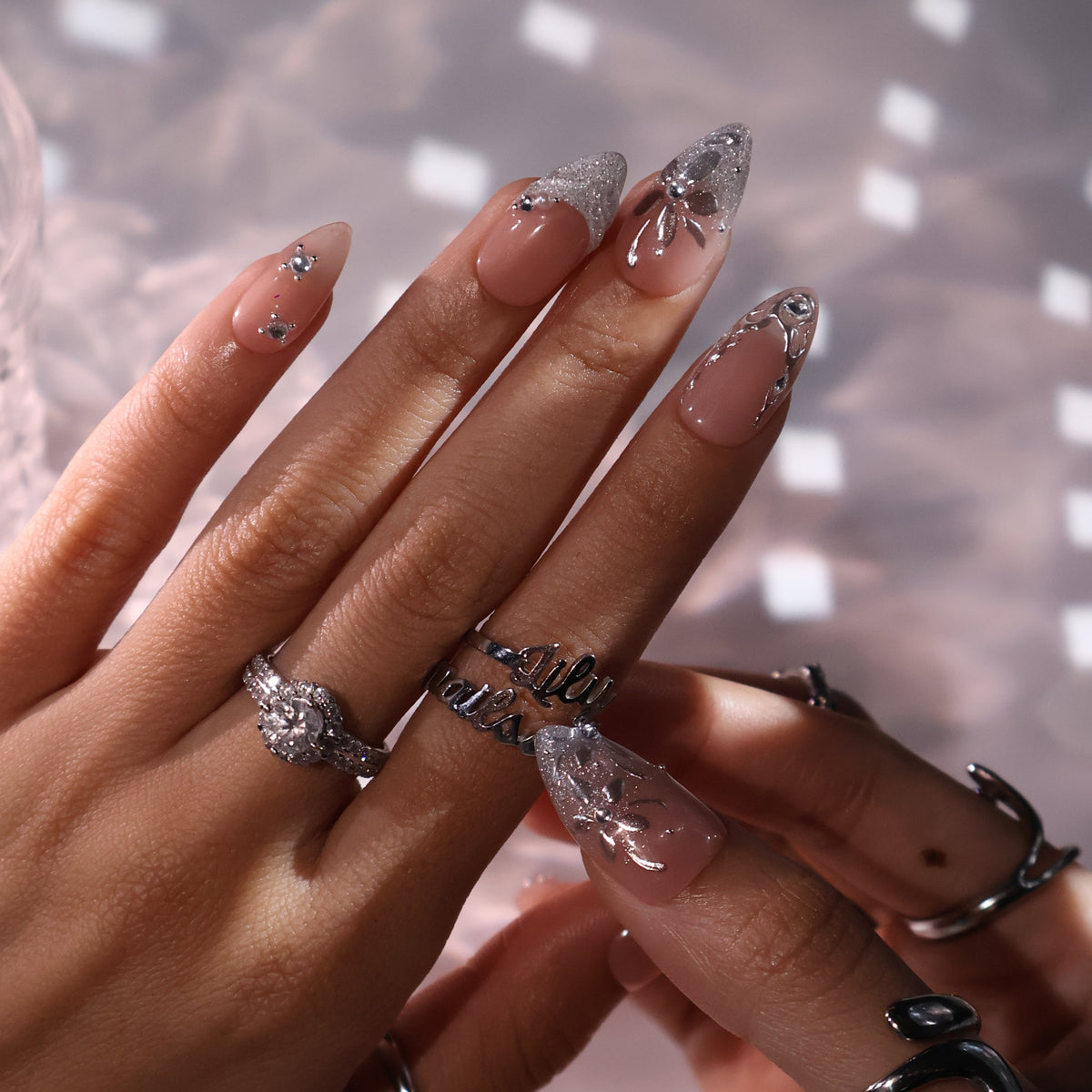 3D silver chrome press on nails with glitter V-tips and sculpted leaf accents, embellished with crystals and silver beads on a nude base — custom press on nails, luxury handmade nail art, fake nails, false nails, pressons — perfect for prom, winter formal, and silver-themed events