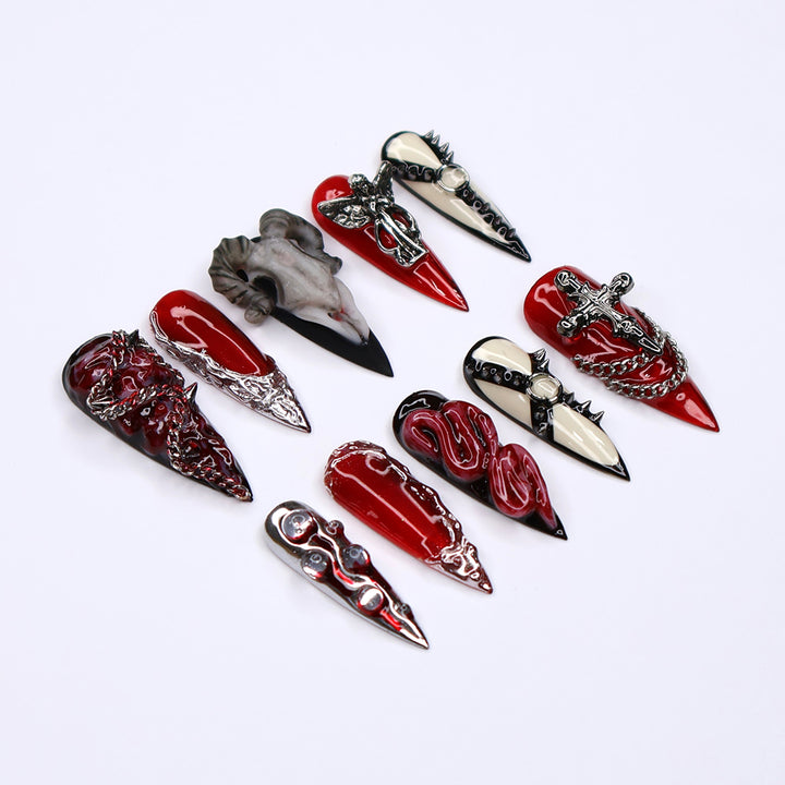 Red, black, and bone press on nails with gothic and horror-inspired 3D designs — handmade stiletto nails, custom press-ons, Halloween nail art, edgy fake nails — perfect for alt fashion, dark beauty looks, and statement nails.