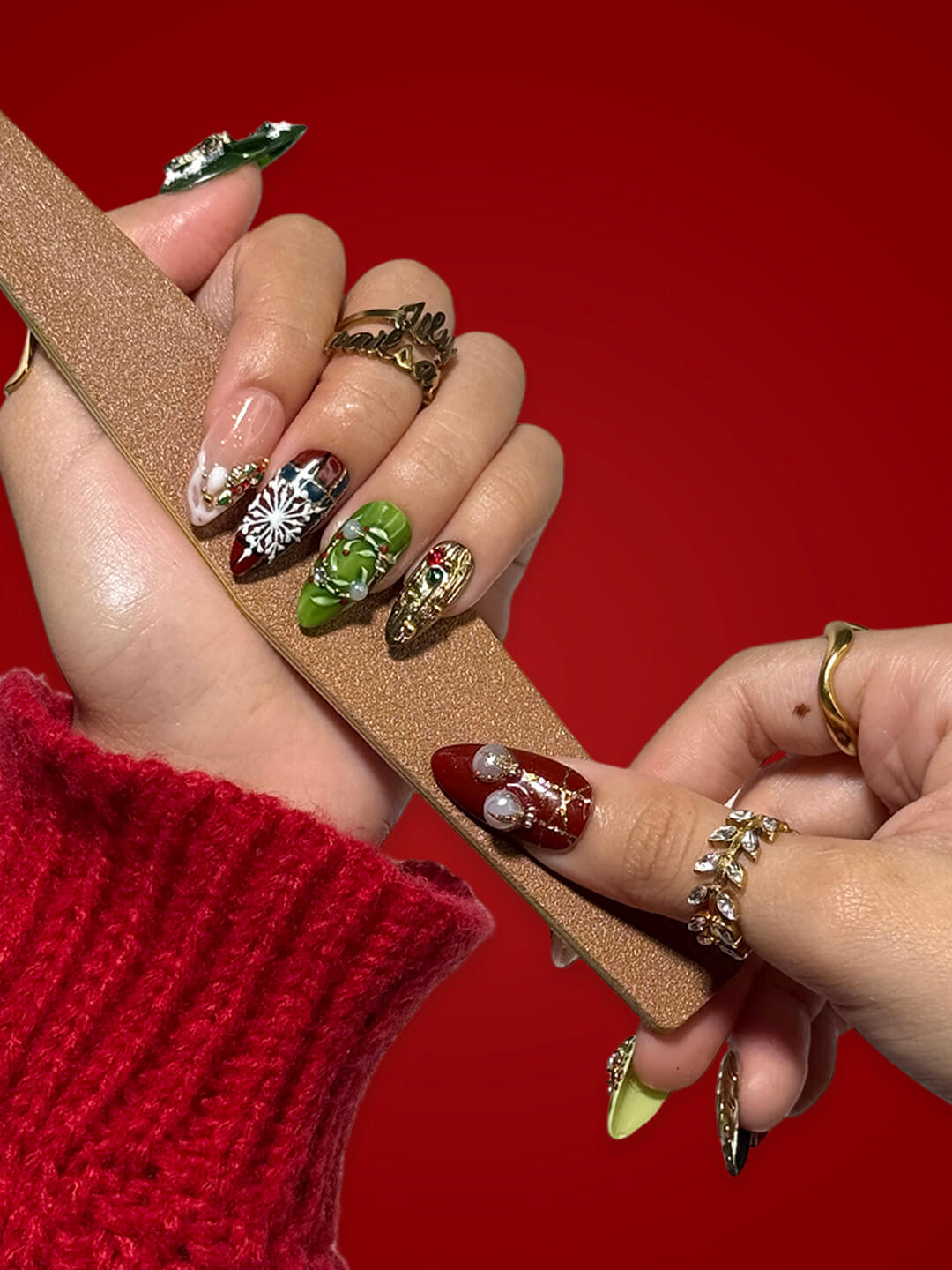 3D Christmas press on nails design in red, green and gold, featuring pearls, snowflakes, wreaths, and bauble charms — luxury holiday fake nails, handmade festive nail art, perfect for Christmas events, winter glam, or as a gift for her.