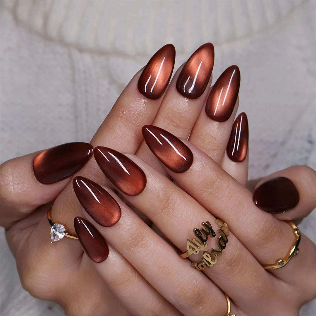Brown Sugar handmade fall press-on nails — Medium almond set in rich caramel-brown with golden cat-eye shimmer, glossy molten finish and minimalist autumn nail art.