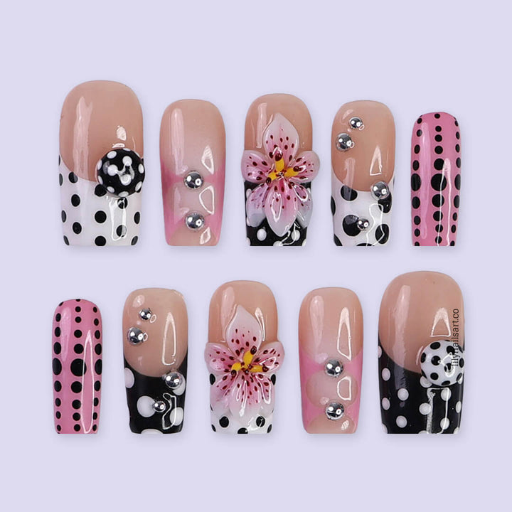 Handmade Medium Square press on nails with a playful mix of pink, black, and white polka dots, 3D pink floral accents, silver bead embellishments, and geometric French tip designs. A bold and feminine style perfect for statement looks.