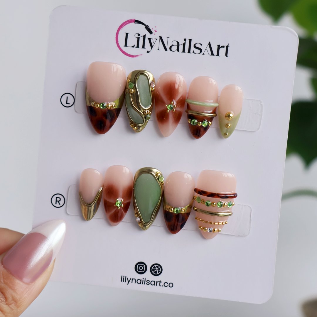 Olivra fall press on nails in tortoiseshell, sage green and gold, shown in Lily Nails Art packaging