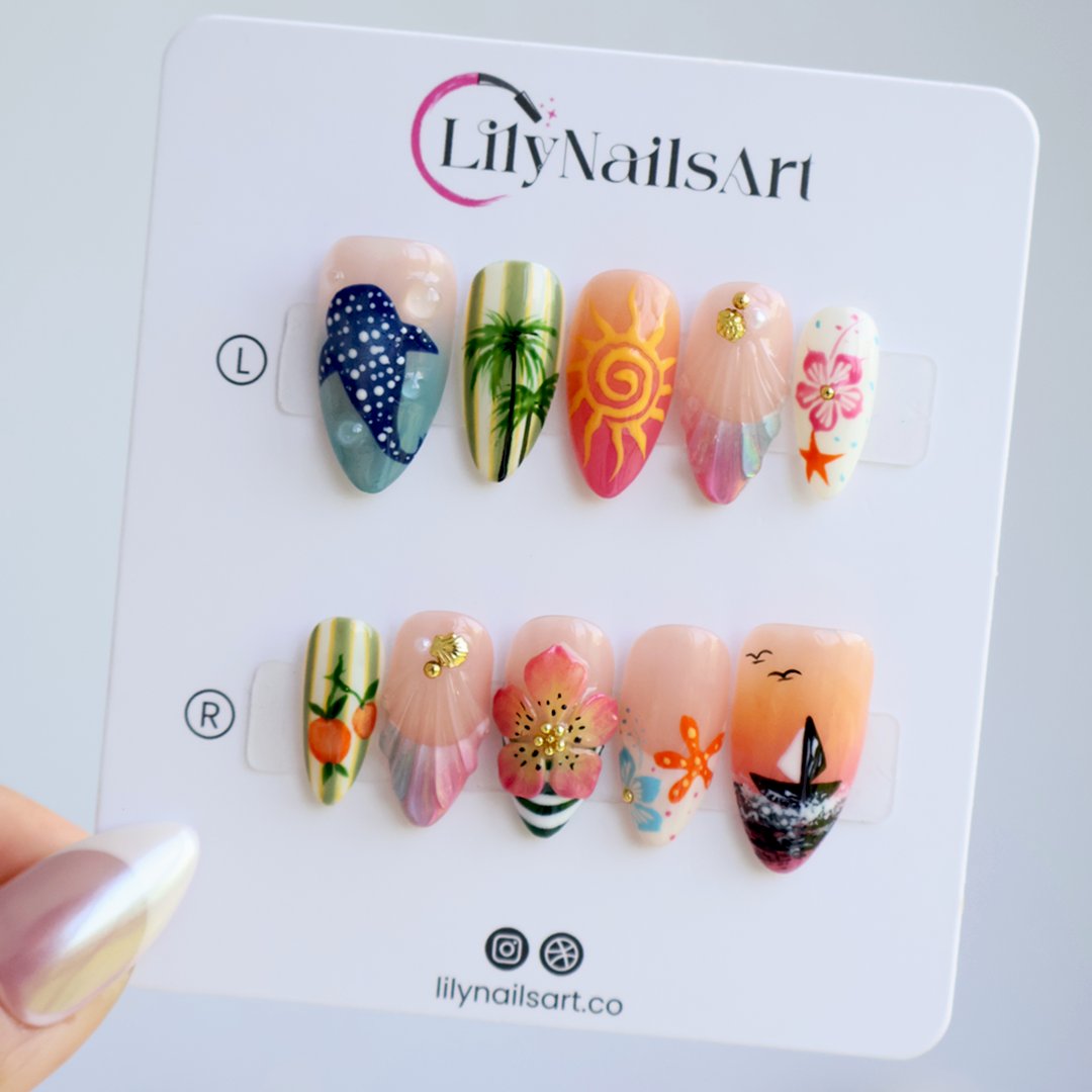 Handmade summer press-on nails with tropical Florida-inspired art featuring palm trees, sunset sailboat, hibiscus and whale shark by Lily Nails Art