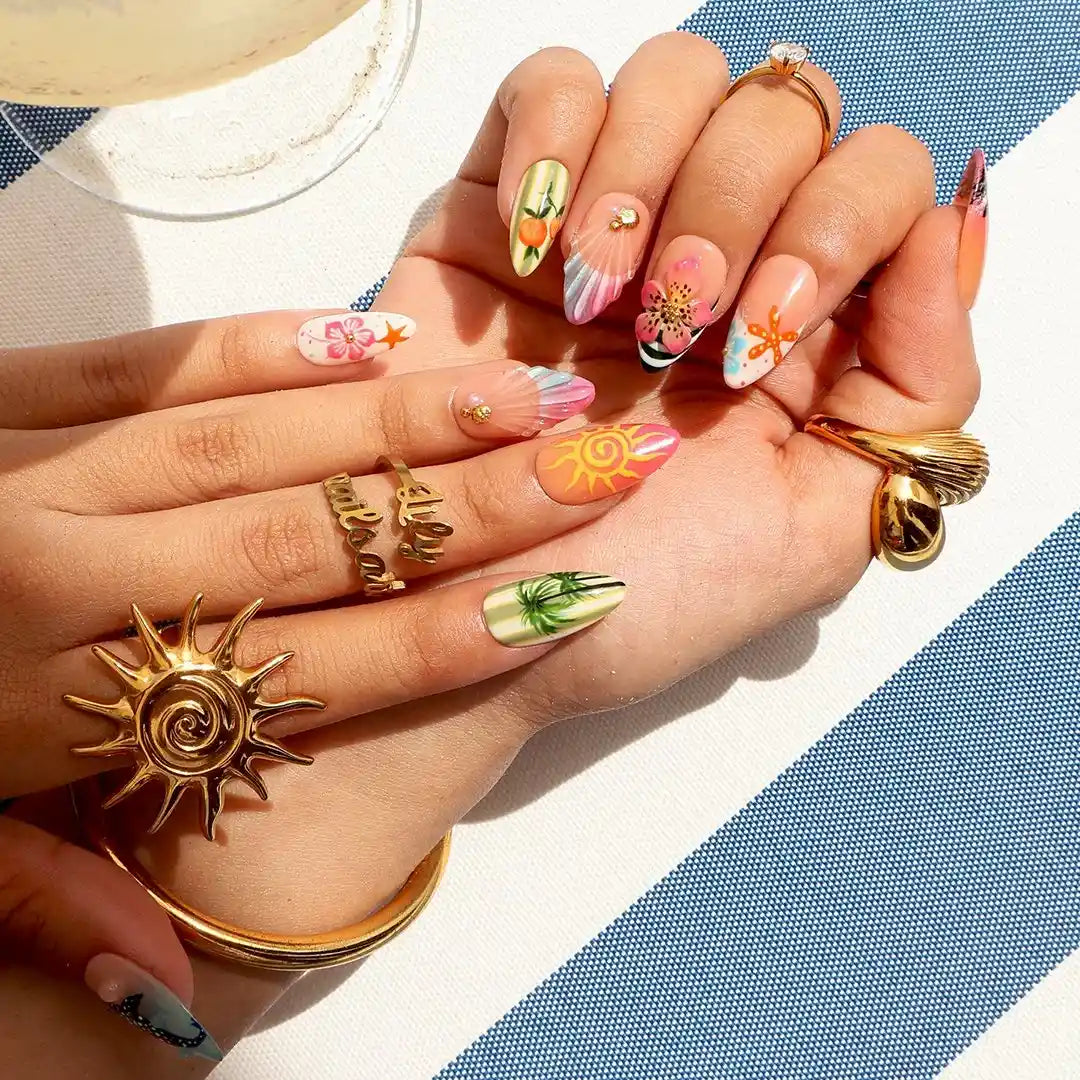 Handmade summer press-on nails with tropical Florida-inspired art featuring palm trees, sunset sailboat, hibiscus and whale shark by Lily Nails Art