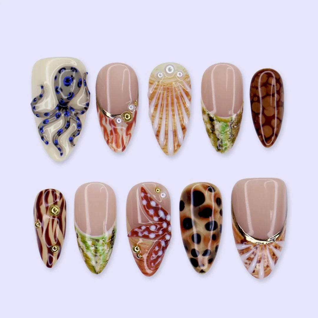 Handmade summer press-on nails with seashell art, blue-ringed octopus, starfish and leopard cowrie print by Lily Nails Art
