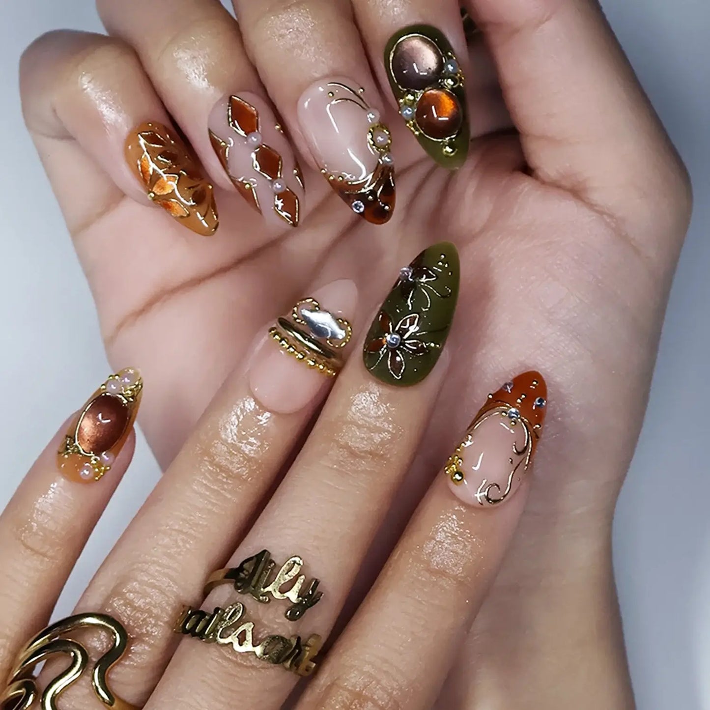 tertoise brown & green handmade fall press-on nails — maximalist medium almond set with amber gemstones, gold filigree and floral detail