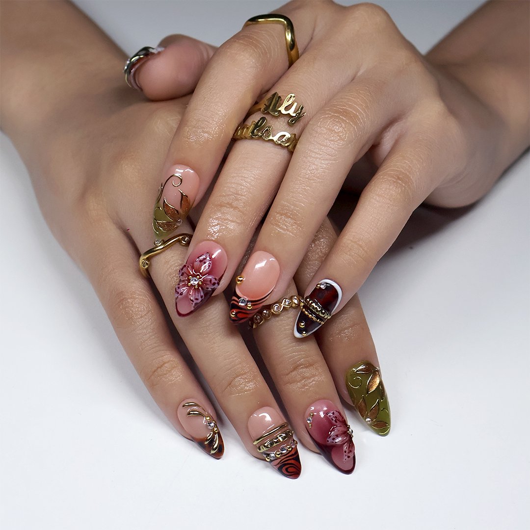 Harvest handmade press-on nails — maximalist medium almond set in nude, olive, rust and tortoiseshell with 3D pink lilies, gold leaves and gems