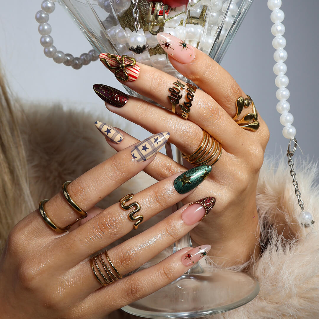 3D red and green custom Christmas press on nails with gold star accents, metallic bows, candy cane stripes, and plaid designs — holiday fake nails, handmade false nails, luxury pressons — perfect for winter parties or as a festive gift idea