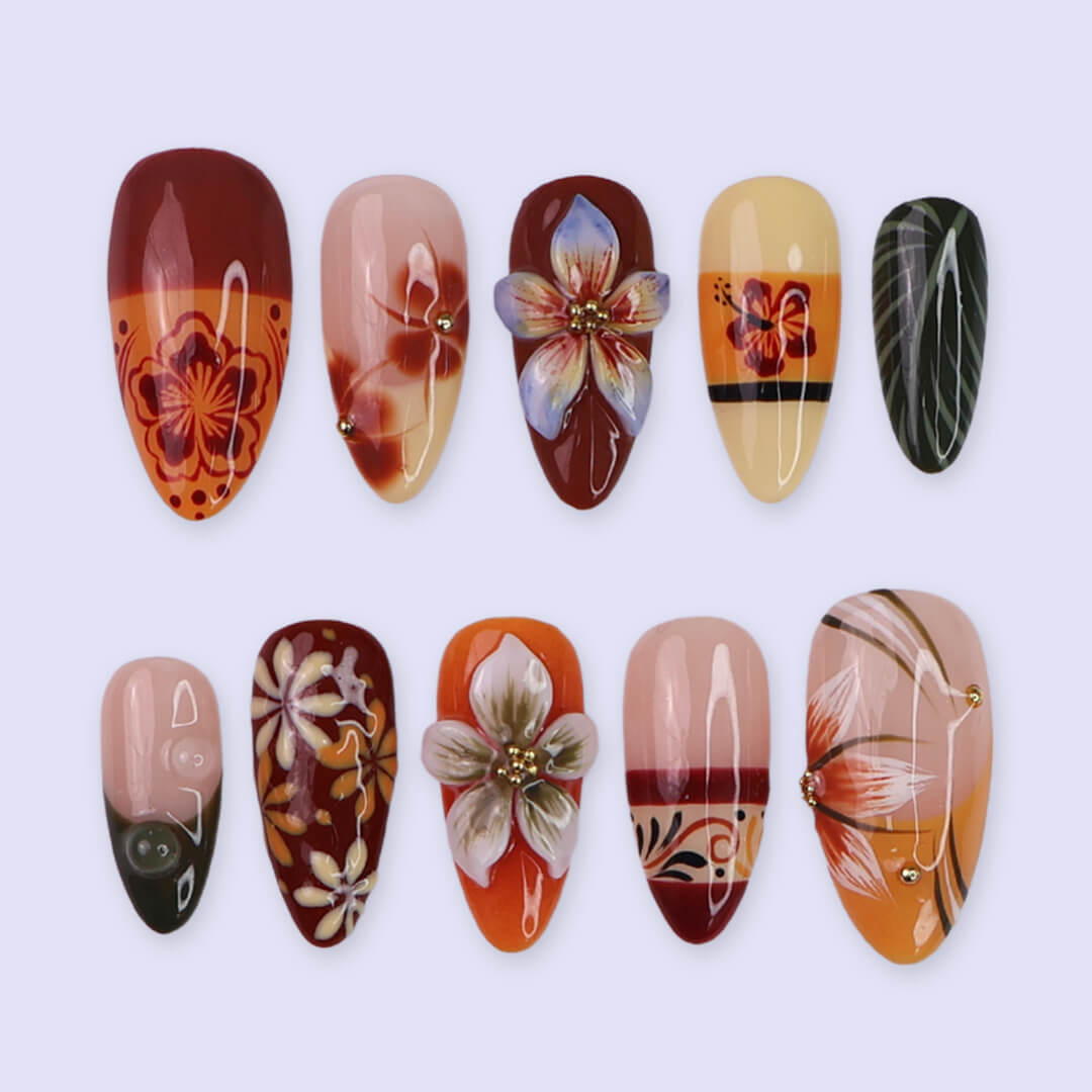Fall inspired press-on nails with hibiscus flowers, tropical leaf accents, and gradients of red, orange, and golden tones — luxury handmade medium almond nails inspired by Tahitian sunsets and glowing embers — perfect for fall look, holiday