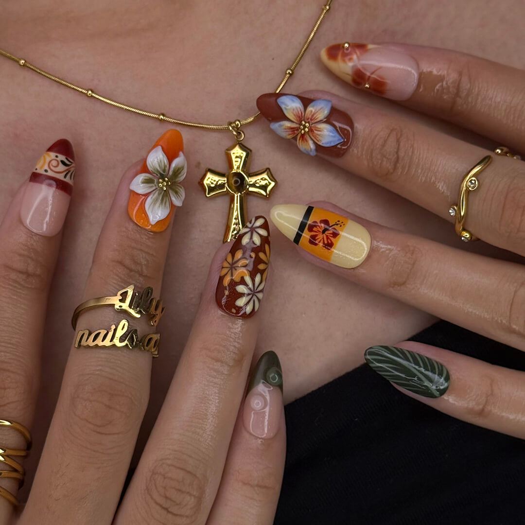 Fall inspired press-on nails with hibiscus flowers, tropical leaf accents, and gradients of red, orange, and golden tones — luxury handmade medium almond nails inspired by Tahitian sunsets and glowing embers — perfect for fall look, holiday