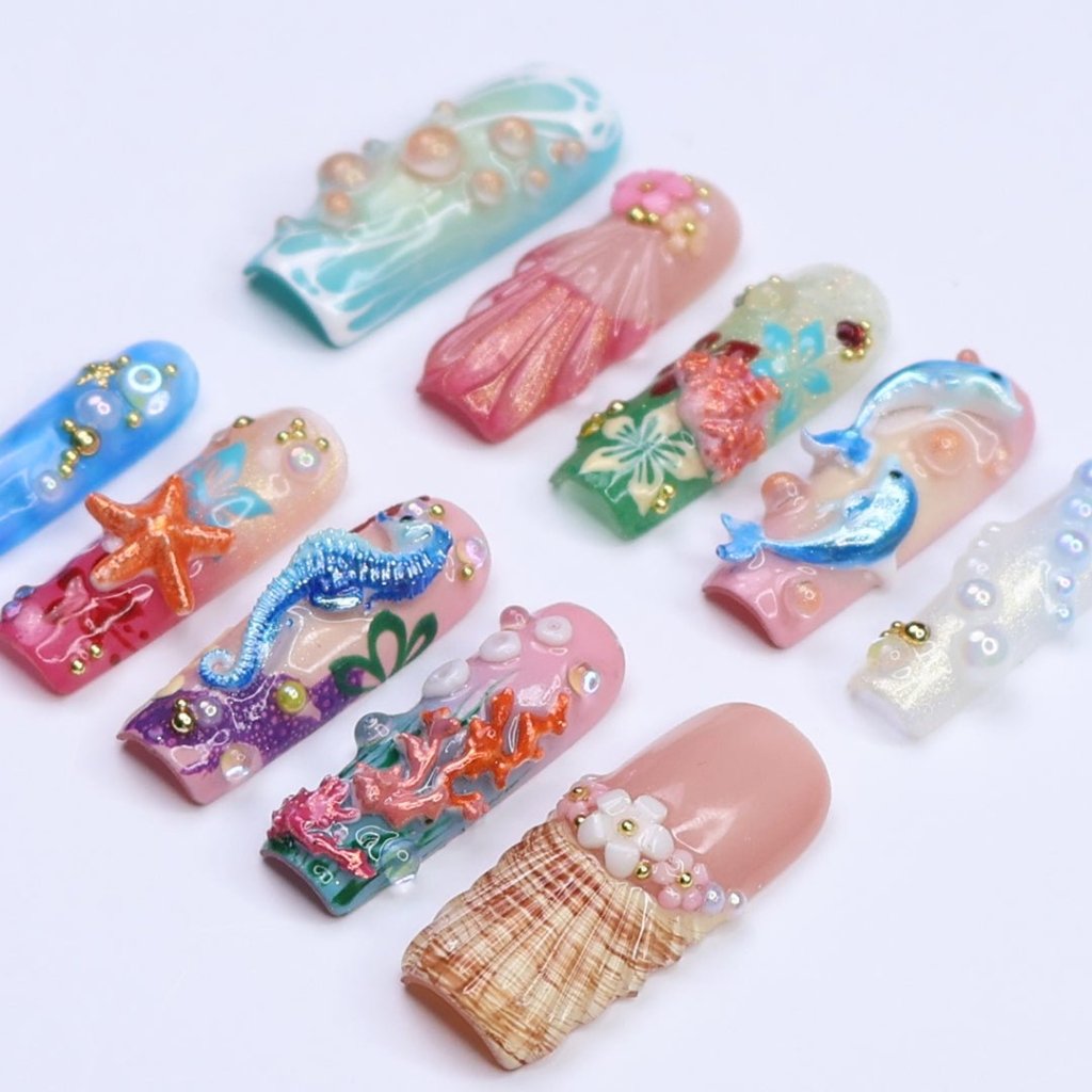 3D ocean press on nails with dolphins, seahorse, starfish, coral reef, and tropical flowers — featuring vibrant colors, glitter seashells, pearl bubbles, and sculpted textures — beach vacation nails, mermaid core press on nails, custom handmade nail art, fake nails, false nails, pressons — perfect for summer getaways, tropical looks, or gifting for ocean lovers.