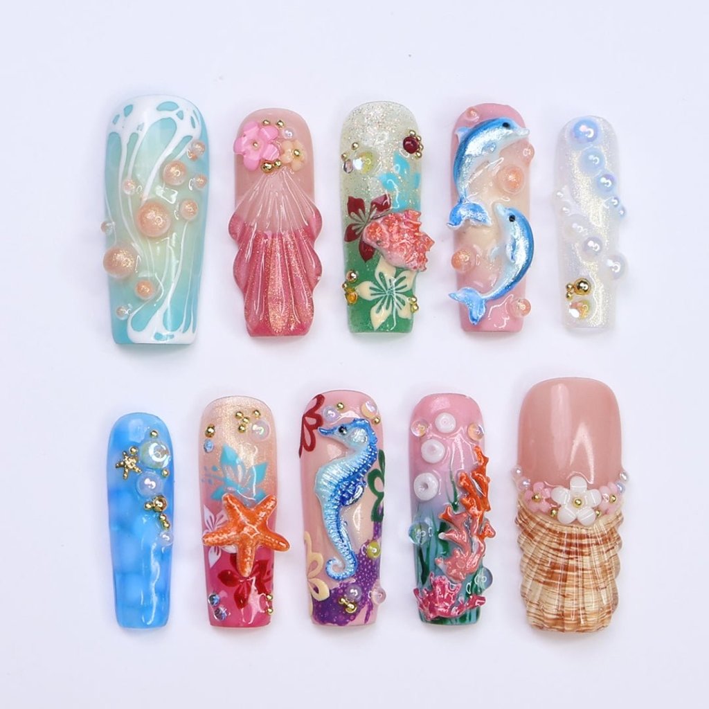 3D ocean press on nails with dolphins, seahorse, starfish, coral reef, and tropical flowers — featuring vibrant colors, glitter seashells, pearl bubbles, and sculpted textures — beach vacation nails, mermaid core press on nails, custom handmade nail art, fake nails, false nails, pressons — perfect for summer getaways, tropical looks, or gifting for ocean lovers.