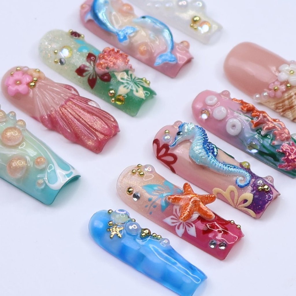 3D ocean press on nails with dolphins, seahorse, starfish, coral reef, and tropical flowers — featuring vibrant colors, glitter seashells, pearl bubbles, and sculpted textures — beach vacation nails, mermaid core press on nails, custom handmade nail art, fake nails, false nails, pressons — perfect for summer getaways, tropical looks, or gifting for ocean lovers.