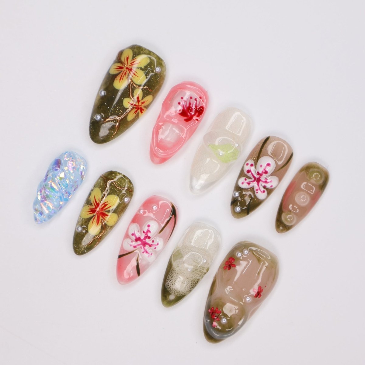 Handmade Tropical Floral Press-On Nails – Spring Collection- earthy green, soft pink, and translucent tones with 3D flowers, pearl accents, and shimmer. Perfect for vacations, beach days, or as a unique gift for her.