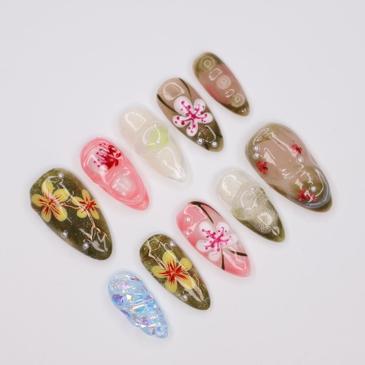 Handmade Tropical Floral Press-On Nails – Spring Collection- earthy green, soft pink, and translucent tones with 3D flowers, pearl accents, and shimmer. Perfect for vacations, beach days, or as a unique gift for her.