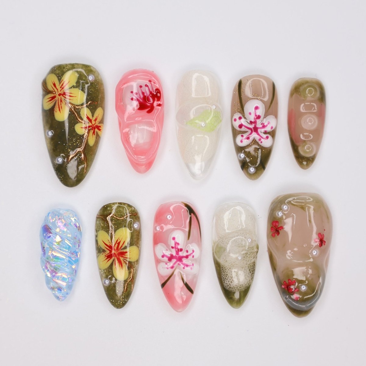 Handmade Tropical Floral Press-On Nails – Spring Collection- earthy green, soft pink, and translucent tones with 3D flowers, pearl accents, and shimmer. Perfect for vacations, beach days, or as a unique gift for her.