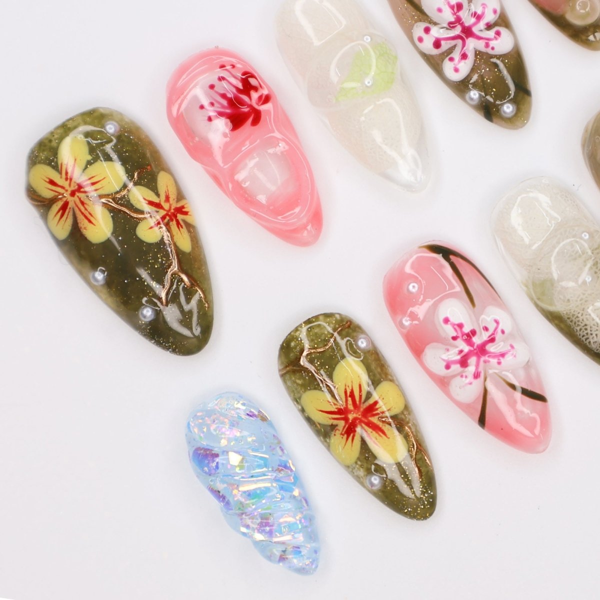 Handmade Tropical Floral Press-On Nails – Spring Collection- earthy green, soft pink, and translucent tones with 3D flowers, pearl accents, and shimmer. Perfect for vacations, beach days, or as a unique gift for her.