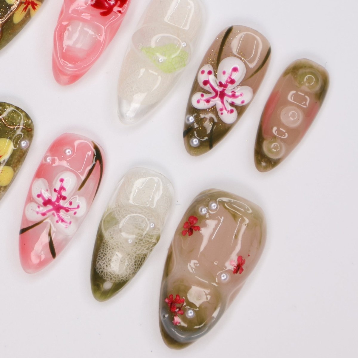 Handmade Tropical Floral Press-On Nails – Spring Collection- earthy green, soft pink, and translucent tones with 3D flowers, pearl accents, and shimmer. Perfect for vacations, beach days, or as a unique gift for her.