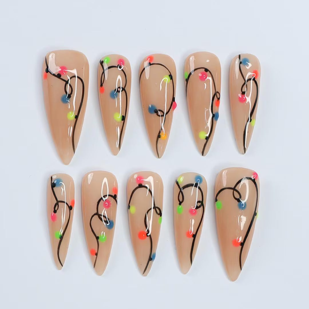 Handmade Christmas press on nails with colorful glowing light string design on stiletto shape — custom holiday nails, luxury fake nails, festive party nail art for Christmas looks and winter events.