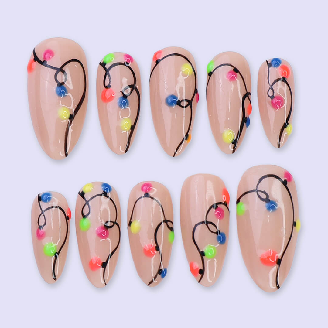 Handmade Christmas press on nails with colorful glowing light string design on stiletto shape — custom holiday nails, luxury fake nails, festive party nail art for Christmas looks and winter events.