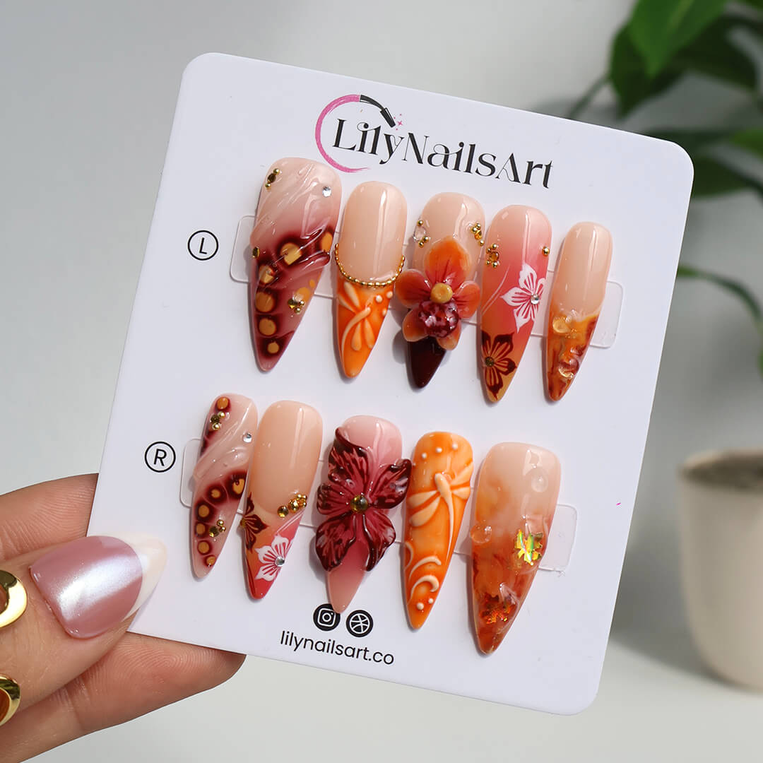 Luxury press-on nails with fiery red and orange gradients, 3D florals, golden flecks, and shimmering accents inspired by dragonfly — handmade long almond nails — perfect for bold fall looks, holiday, birthday