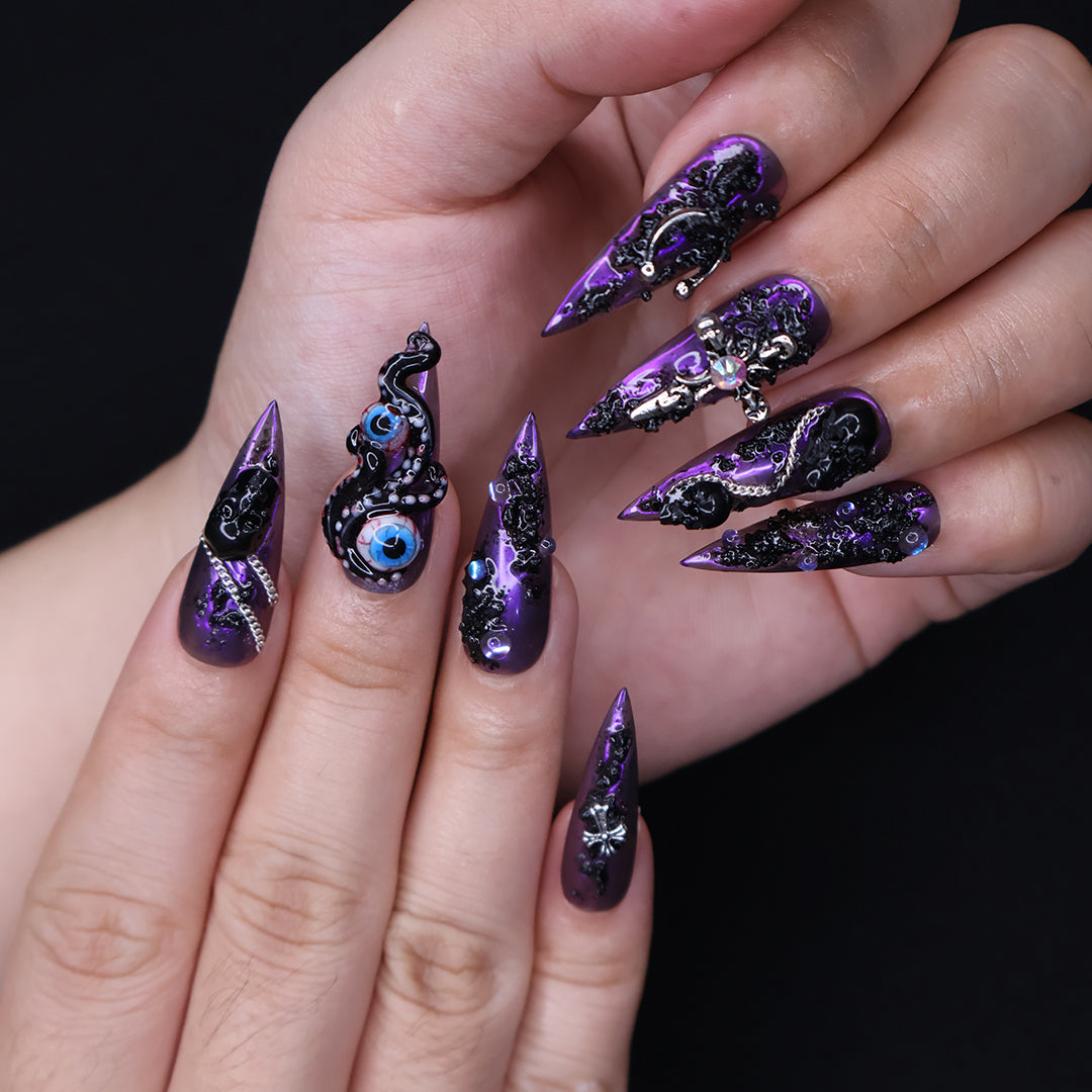 Black and purple chrome press on nails with eerie, horror-inspired handmade 3D elements — custom gothic nails, stiletto press ons, handmade false nails, spooky nail art — perfect for Halloween season, alt fashion, and dark feminine energy.
