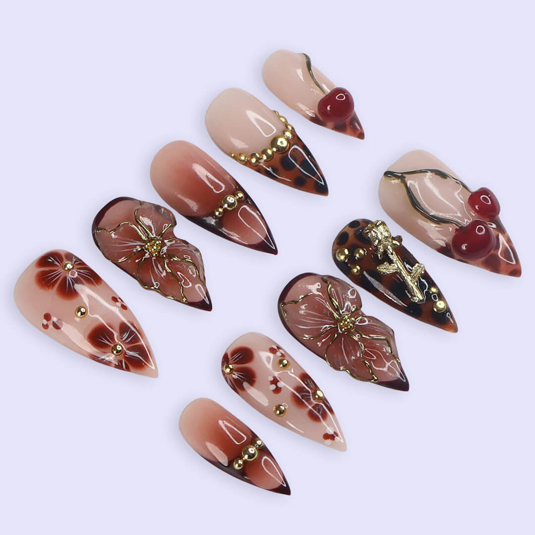 Medium stiletto press on nails with red cherry accents, 3D floral designs, tortoiseshell tips, and gold embellishments — luxury handmade false nails for date nights, self-expression, or gifting. Custom press on nails, reusable nail art, fake nails for beauty lovers.