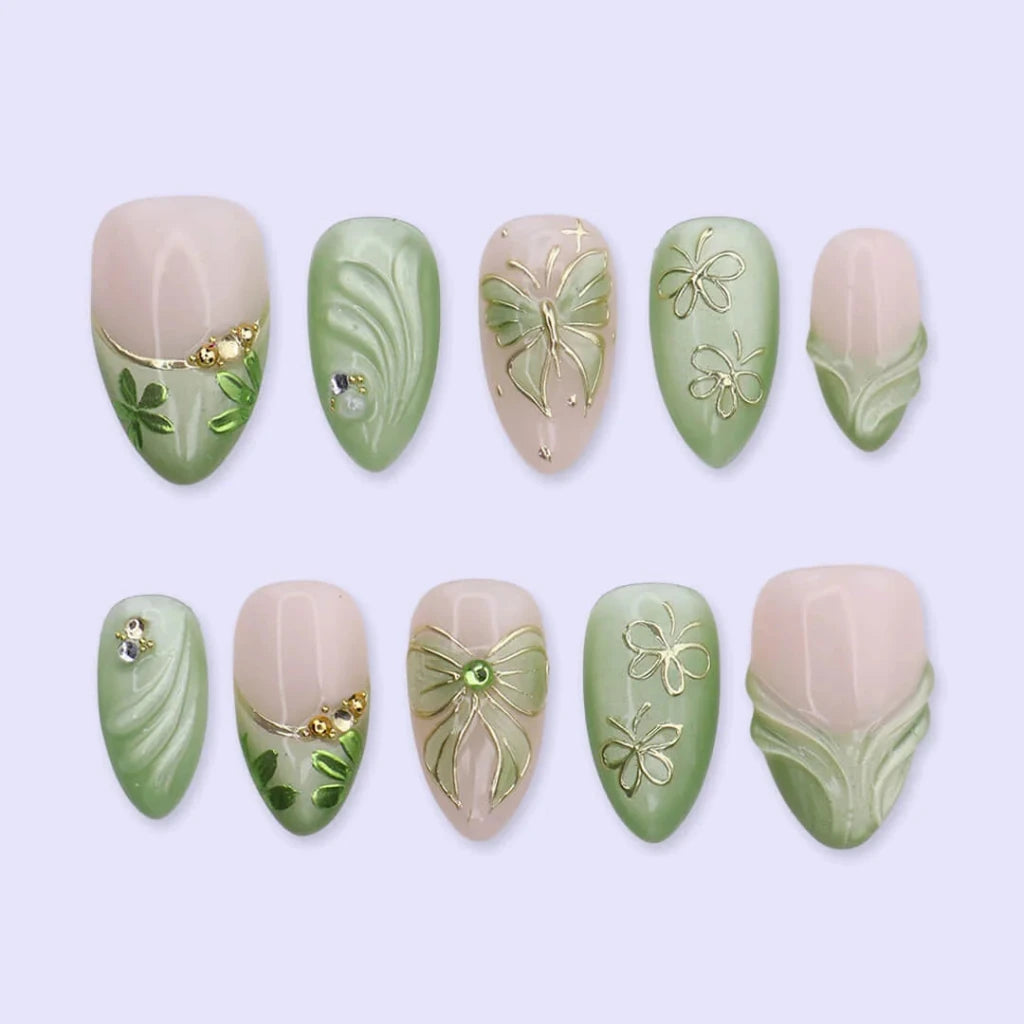 3D sage green chrome press on nails with gold bow and butterfly-lace accents, embellished with crystals and wave texture — custom press on nails, luxury handmade nail art, fake nails, false nails, pressons — perfect for prom, spring events, and garden parties