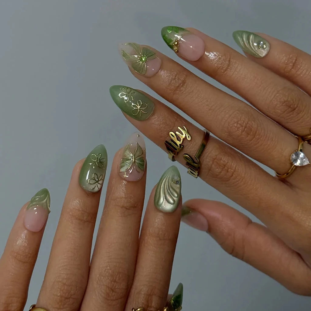 3D sage green chrome press on nails with gold bow and butterfly-lace accents, embellished with crystals and wave texture — custom press on nails, luxury handmade nail art, fake nails, false nails, pressons — perfect for prom, spring events, and garden parties