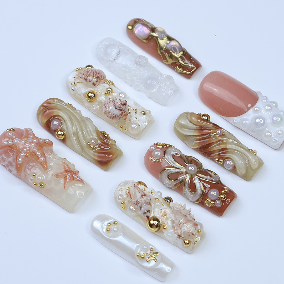 3D luxury beach press on nails with starfish, seashells, pearl clusters, and gold embellishments — featuring sculpted waves, iridescent textures, metallic accents, and under-the-sea details in nude, ivory, and sand tones — summer vacation nails, ocean press on nails, custom handmade nail art, fake nails, false nails, pressons — perfect for coastal getaways, beach photoshoots, or elegant summer looks.