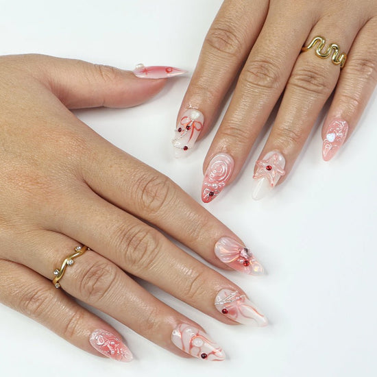 Blush pink press-on nails with 3D bows and shimmering accents, ideal holiday nails, birthday nails, spring nails, or a thoughtful gift for her.