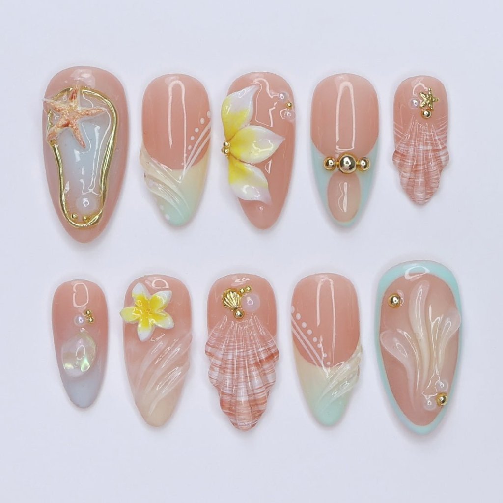 3D beach press on nails with seashells, starfish, plumeria flowers, and soft pastel waves, featuring gold charms, pearl details, and glossy ocean-inspired accents — summer vacation nails, ocean press on nails, custom handmade nail art, fake nails, false nails, pressons — perfect for tropical getaways, beach weddings, or gifting for her.
