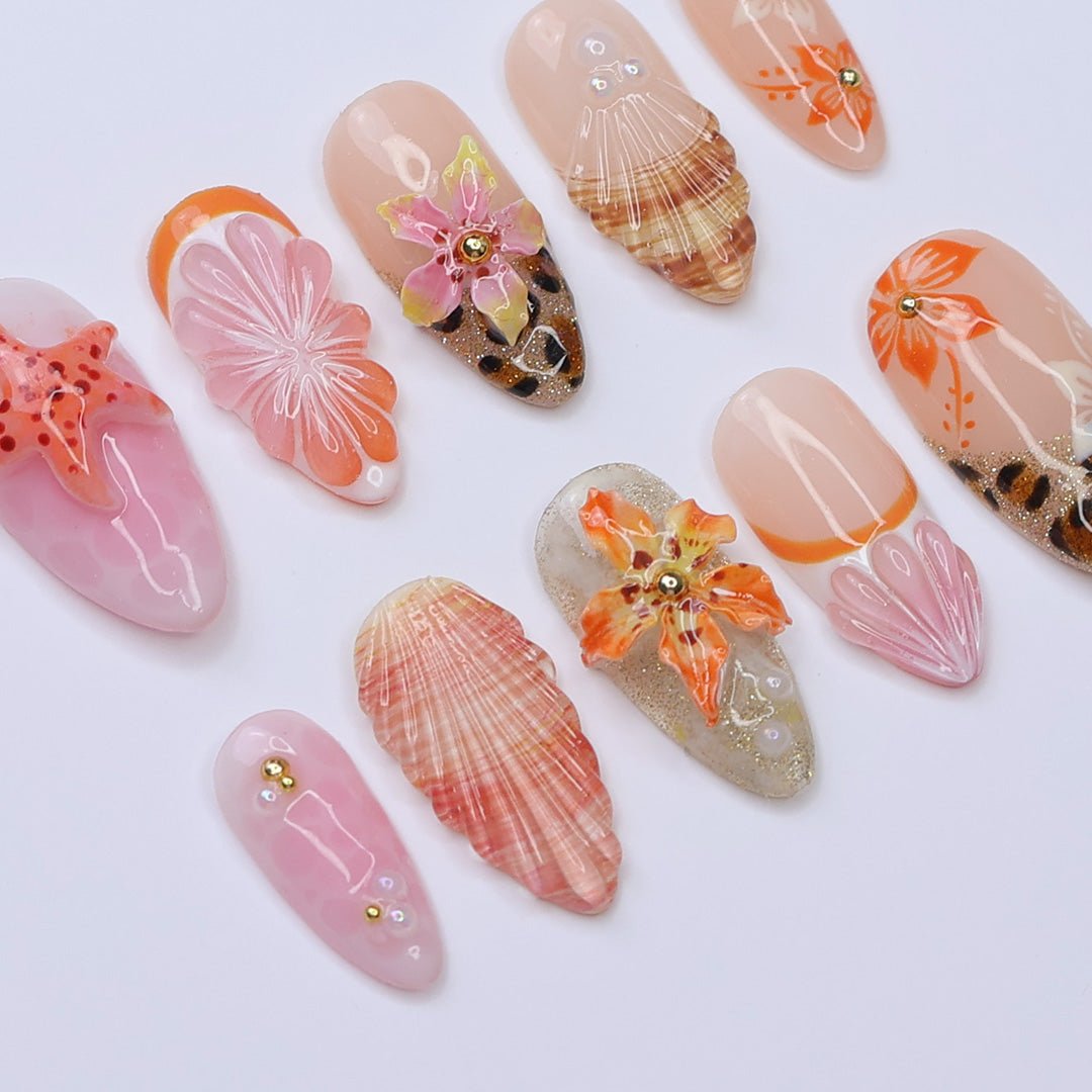 3D beach-themed summer press on nails with starfish, seashells, leopard print, and tropical flower accents, featuring soft pink and coral tones, gold glitter, and sculpted sea elements — summer vacation nails, ocean press on nails, custom handmade nail art, fake nails, false nails, pressons — perfect for tropical getaways, cruises, or summer gifting.
