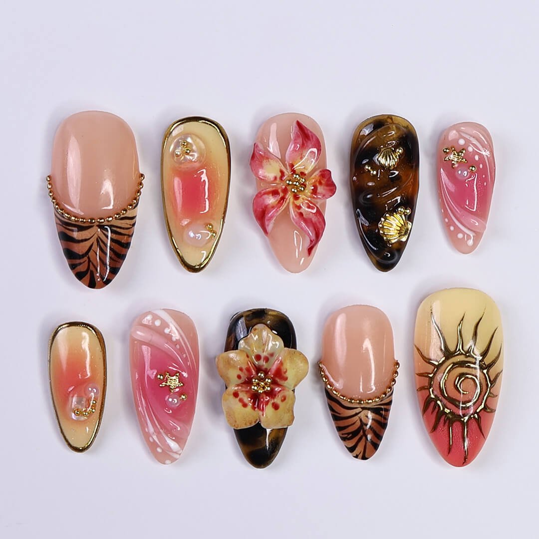 3D tropical press on nails with sculpted florals, tribal sun emblems, and gold details in coral, tan, and black tones — handmade nail art, reusable false nails, medium almond shape — perfect for beach vacations, holiday or summer festivals
