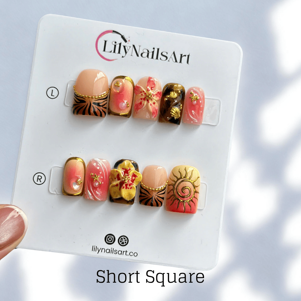 3D tropical press on nails with sculpted florals, tribal sun emblems, and gold details in coral, tan, and black tones — handmade nail art, reusable false nails, medium almond shape — perfect for beach vacations, holiday or summer festivals