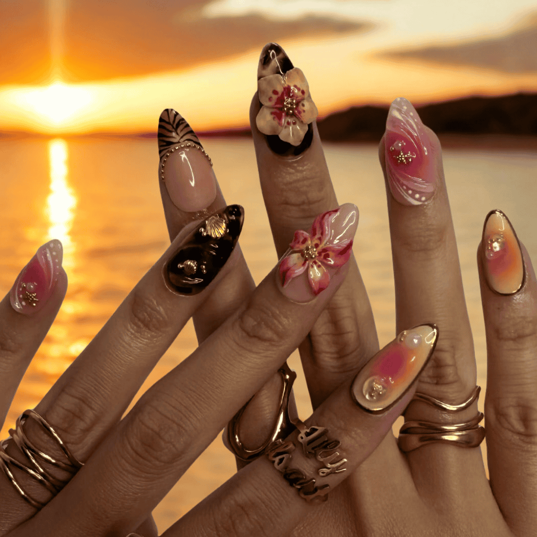 3D tropical press on nails with sculpted florals, tribal sun emblems, and gold details in coral, tan, and black tones — handmade nail art, reusable false nails, medium almond shape — perfect for beach vacations, holiday or summer festivals