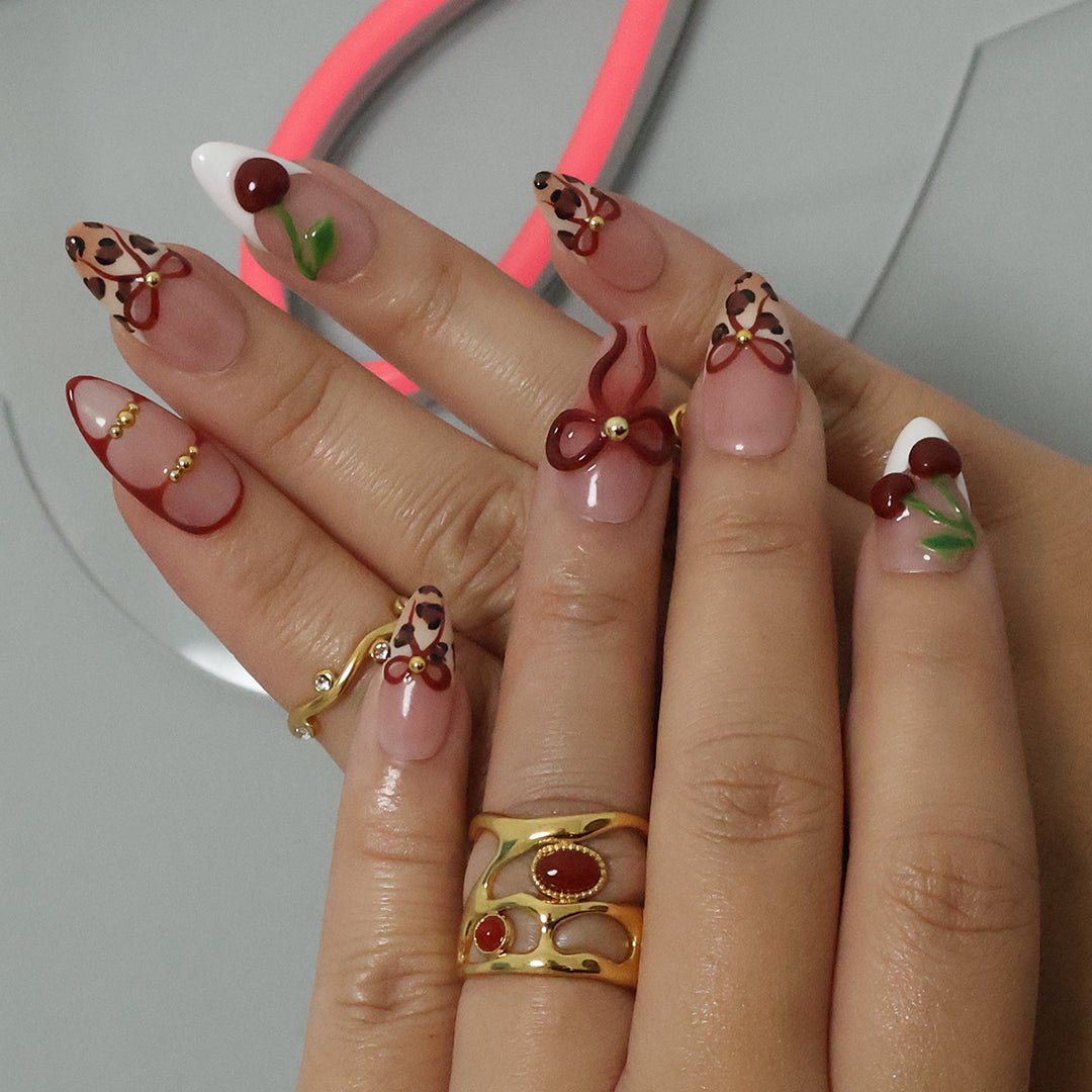 cherry fruit 3d press on bows3d nails valentines day nails Chic designer press-on nails featuring a bold mix of leopard print, 3D cherries, and sculpted bows. These salon-quality, reusable press-on nails blend trendy animal print with playful, glossy red accents for a stylish and feminine look. A premium alternative to Kiss and Glamour Press-On Nails, perfect for fashion-forward nail lovers. Shop custom, high-quality press-on nails for a long-lasting, statement manicure.