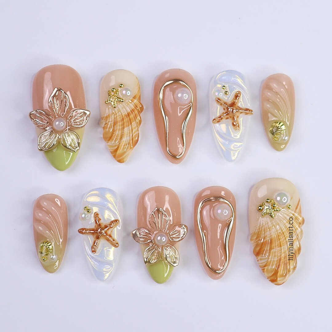 3D nude and gold press-on nails with sculpted shells, pearl flowers, flip-flop charms, and ocean swirl textures — luxury handmade nail art with earthy sage, cream, and amber tones — perfect for beach weddings, coastal getaways, or understated summer elegance.