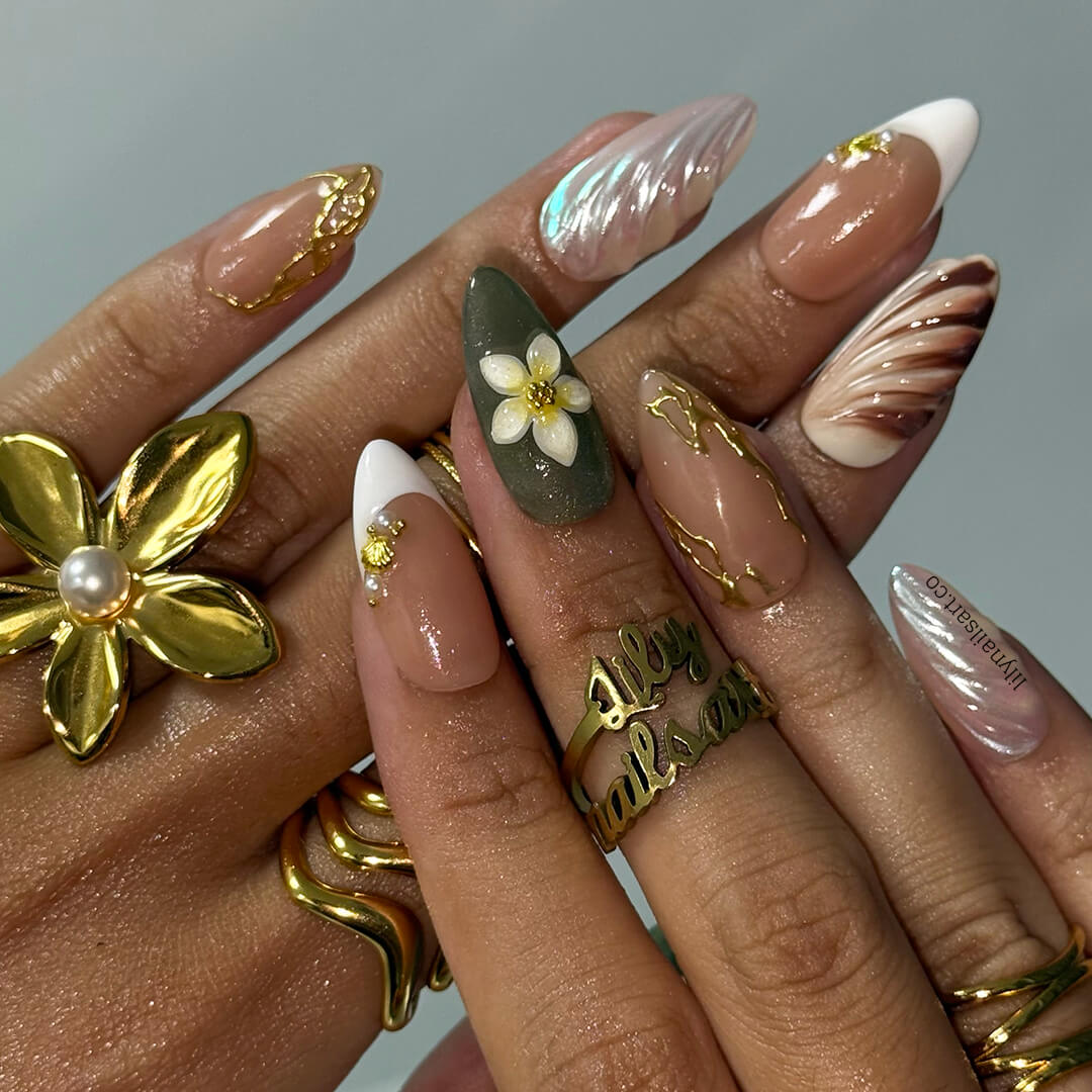 3D press-on nails featuring sculpted flowers, seashell swirl textures, pearl accents, and gold linework — handmade custom nails in earthy sage green, bronze, nude, and soft white tones — perfect for destination weddings, luxury getaways, or elegant summer days, holiday