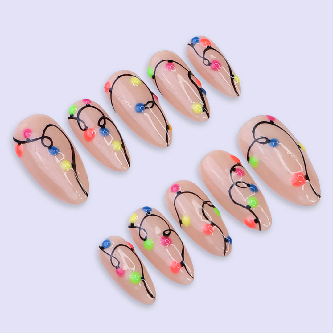 Handmade Christmas press on nails with colorful glowing light string design on stiletto shape — custom holiday nails, luxury fake nails, festive party nail art for Christmas looks and winter events.