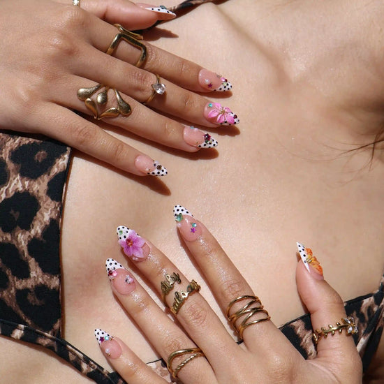 Handmade summer press-on nails with black polka dot French tips, tiger lily, orchid and rainbow gemstone confetti embellishments by Lily Nails Art