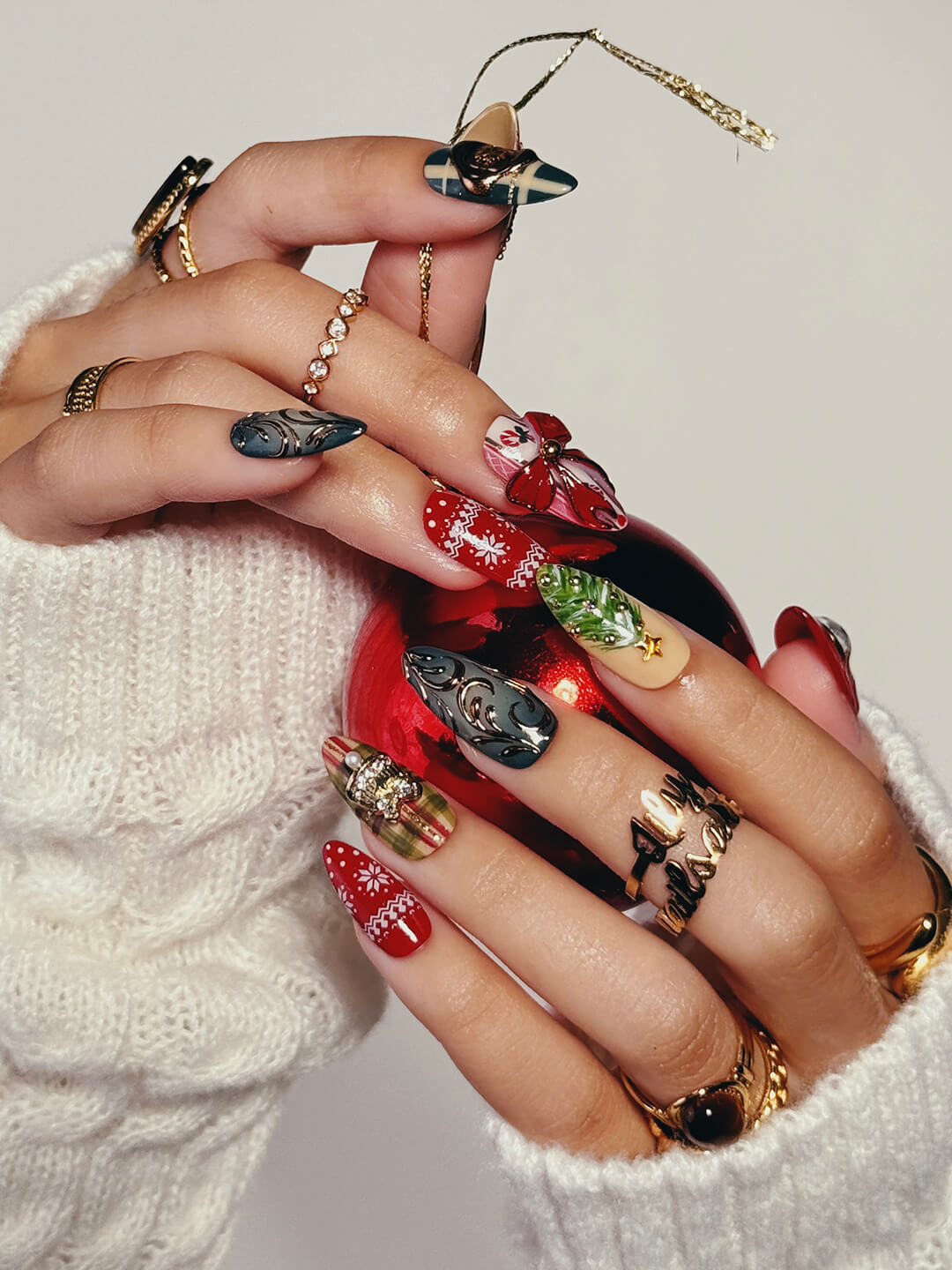 3D maximalist Christmas press-on nails with plaid, ornaments, snowflakes, and bows in red, green, and gold — handmade nail art, luxury press-on nails, reusable false nails, perfect for holiday glam or festive gifts.