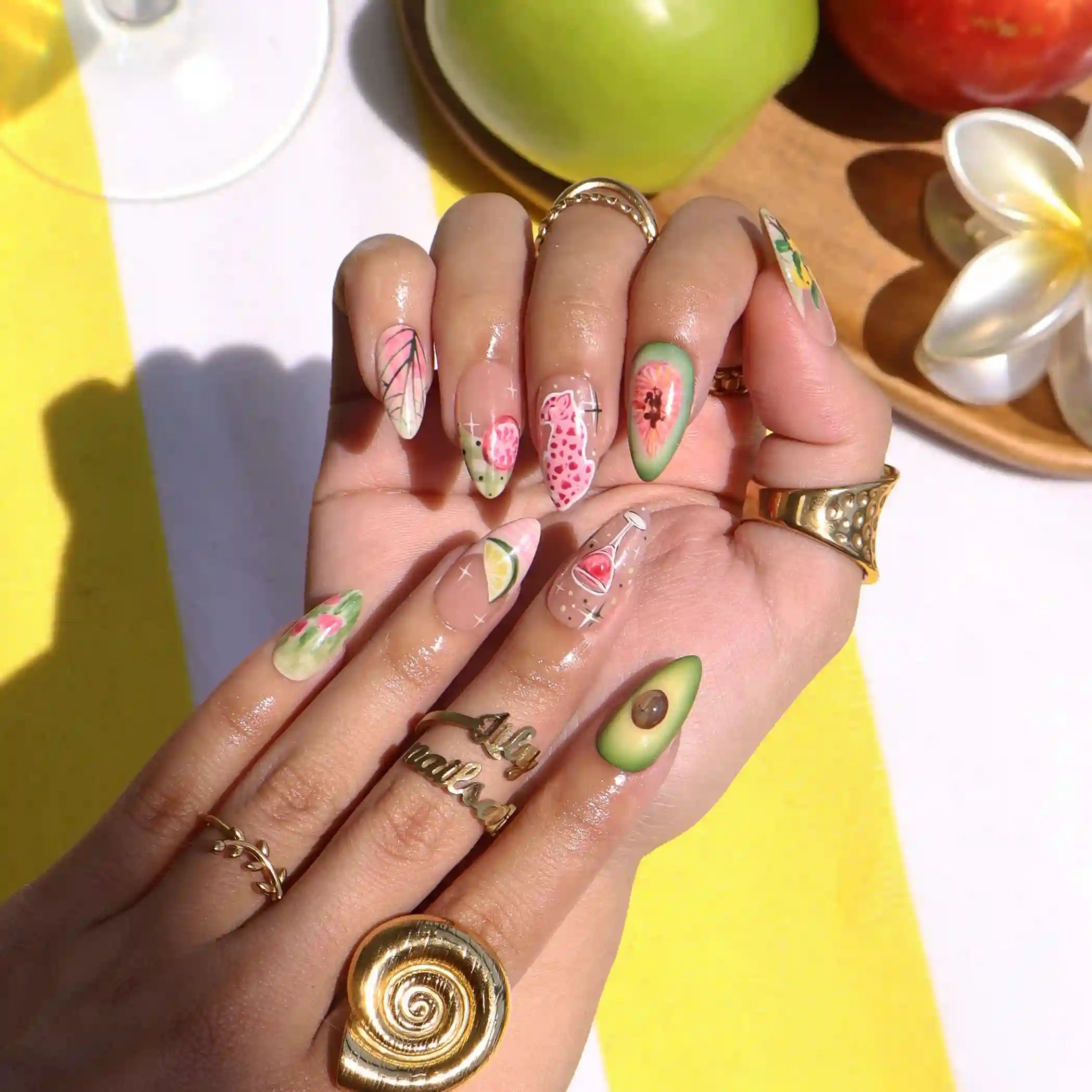 Handmade summer press-on nails with hand-painted avocado, wine glass, lime slice, pink leopard and tropical floral art by Lily Nails Art
