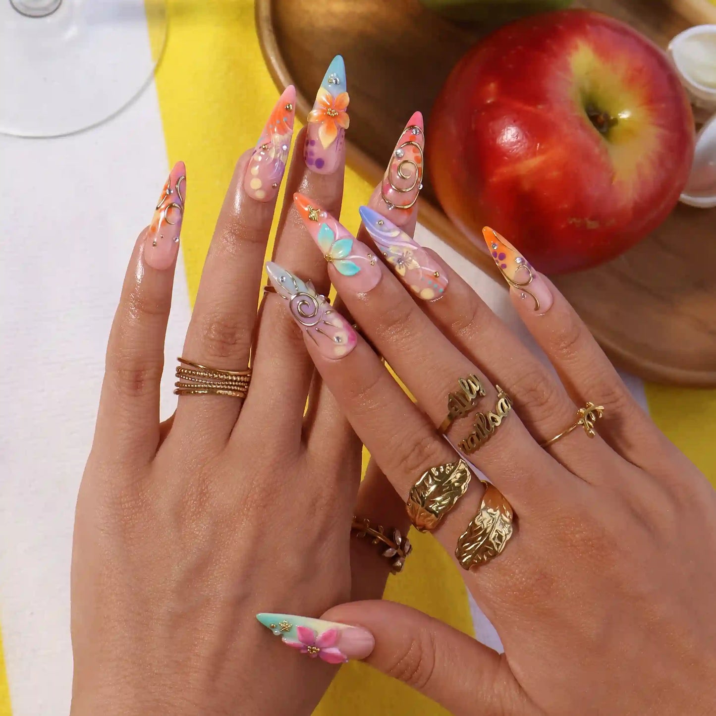 Handmade summer stiletto press-on nails with abundant multicolour florals, 3D blooms, gold spiral charms and crystal embellishments by Lily Nails Art
