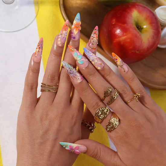 Handmade summer stiletto press-on nails with abundant multicolour florals, 3D blooms, gold spiral charms and crystal embellishments by Lily Nails Art
