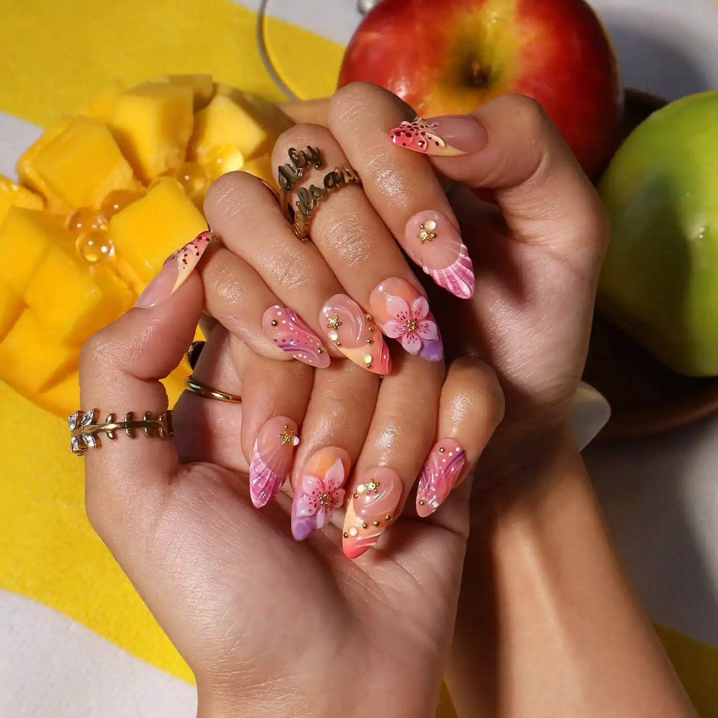 Handmade summer press-on nails with rose and lavender watercolour florals, 3D bloom centrepiece and gold star embellishments by Lily Nails Art