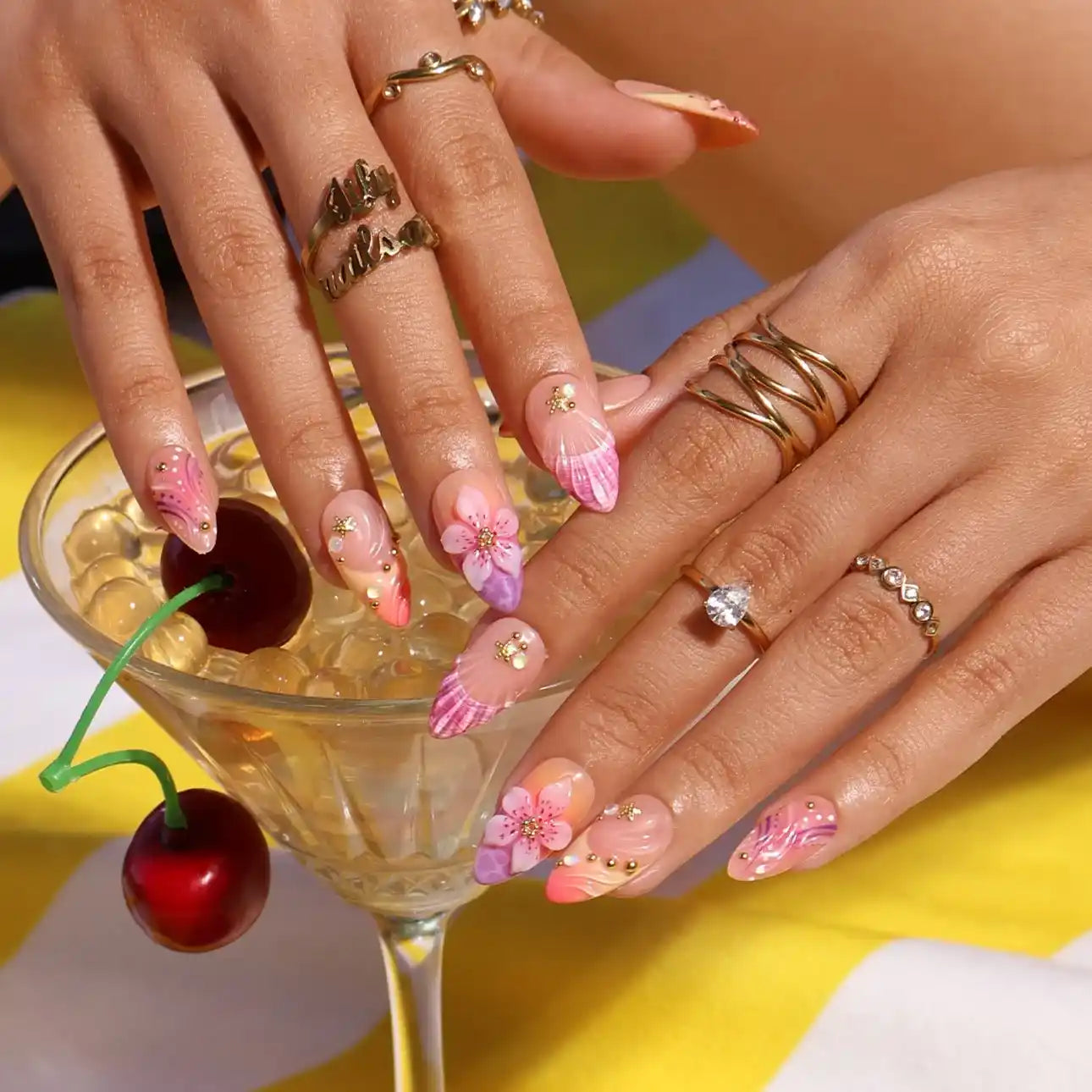 Handmade summer press-on nails with rose and lavender watercolour florals, 3D bloom centrepiece and gold star embellishments by Lily Nails Art
