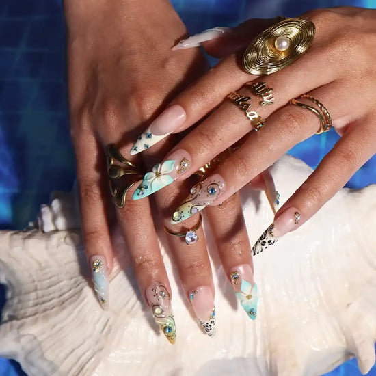 Handmade luxury summer stiletto press-on nails with aqua florals, 3D iridescent bloom, black animal print and gold crystal embellishments by Lily Nails Art
