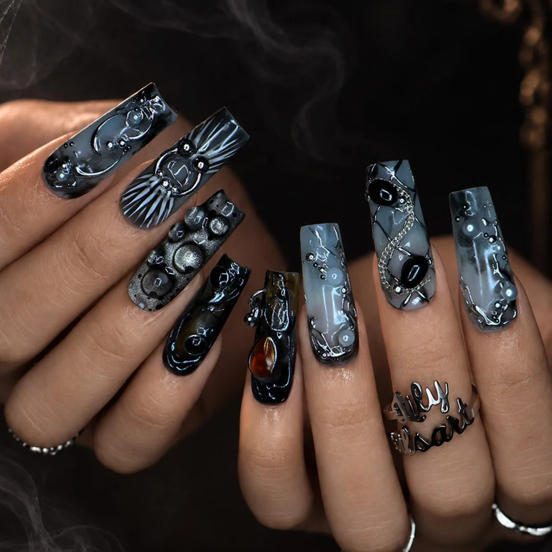 Alchemy gothic press on nails in smoky grey, black and olive with amber and onyx cabochons, silver hoops, chains and bubbling pearl textures — handmade Halloween press on nails, long square fake nails and witchy gothic nail art.